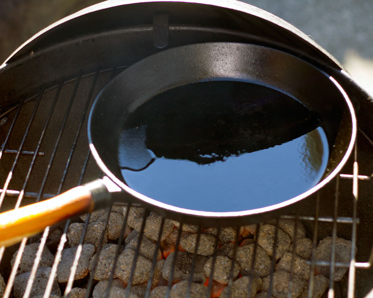 heating oil over coals